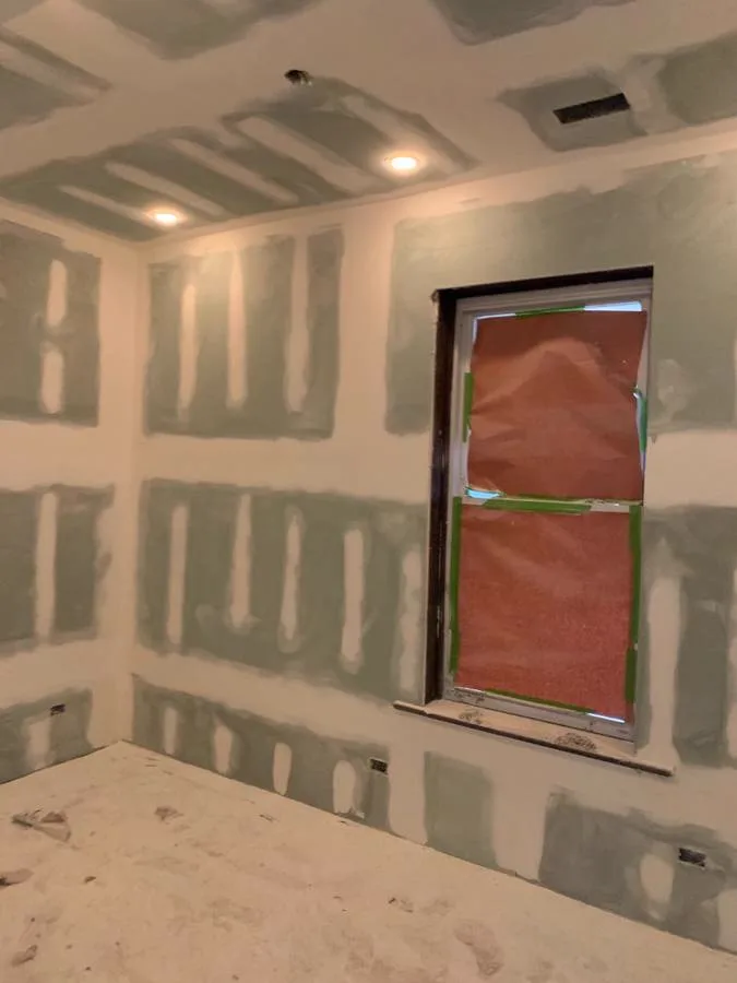 Joint compound coated and sanded on new drywall